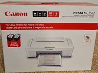 Front view of sealed Canon PIXMA MG2522 printer box showing printer image and included ink cartridges