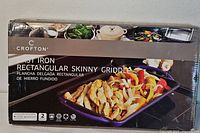 Front of retail box showing Crofton cast iron rectangular skinny griddle image and branding.
