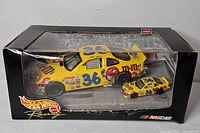 Front view of boxed Hot Wheels Racing set showing both cars