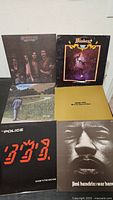 Five LP covers including The Police, Jimi Hendrix, Cat Stevens
