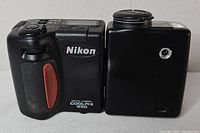 Front view of Nikon Coolpix 950 showing lens section rotated and body logos