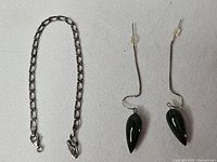 Bracelet and earrings laid out together