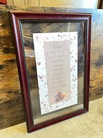 Front view of framed quote in dark cherry wood frame