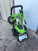 Front view showing cart, handle, wand, wheels and detergent tank