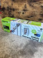 Retail box showing Playzone-fit Kidtrix doorway swing