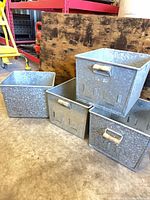 all four galvanized bins stacked and side by side