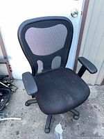 Front view of Tempur-Pedic black mesh office chair showing mesh back, seat, arms, and base