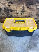 Closed Voyager toolbox showing yellow lid, black body