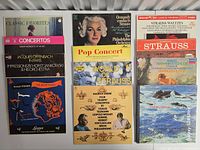 Twelve album covers shown in two columns