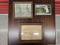 All three framed items grouped on wooden surface