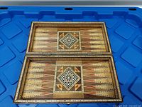 Open folding inlaid board showing both interior halves