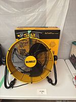Assembled DeWalt drum fan in front of sealed retail box