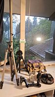Both Velbon tripods, bag, beanbag mount, suction cup mount and bracket on windowsill