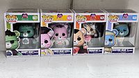 All four Funko Pop figures boxed front view