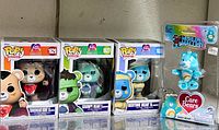 Front view of all three Funko Pop boxes and sealed Wish Bear micro figure