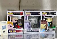 Front view of three boxed Funko Pop figures (#729, #1130, #203)