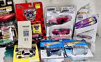All seven packaged die-cast cars displayed together