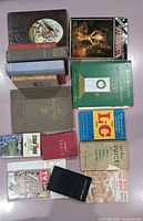 All fifteen books laid out showing covers and spines