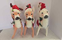 Front view of three Annalee reindeer plush figures
