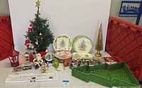 Full lot overview with tree, ornaments, tableware, CDs and baskets