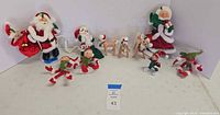 Full lot overview showing all 11 Christmas figurines