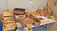 Overall view of assorted baskets arranged on table including magazine rack