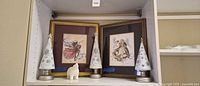 Full lot view: three light-up trees, two framed prints, ceramic bear