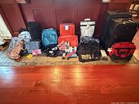 Full lot front view showing all luggage, bags and accessories