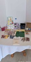 Full layout of stationery, pens, clipboard, glasses, trivia game