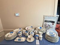 Full dinnerware set displayed on table