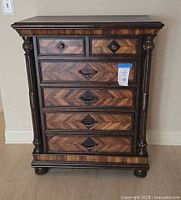 Full front view of six-drawer dresser showing overall design, columns and feet