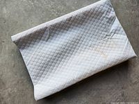 Top view of quilted white baby changing pad
