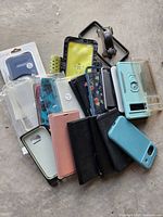 Group shot of all phone cases, armband and mount