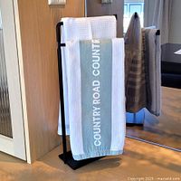 Holder with towels in use on countertop