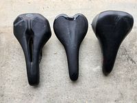 Top view of three bike saddles