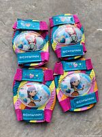 Front view of four Schwinn pads showing graphics and branding