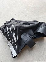 Single skate protector showing reflective stripes and Velcro strap