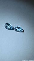 Pair of pear-cut sky blue topaz gemstones