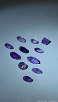 Overview of all amethyst gemstones on neutral background