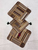 Three kilim cushion covers front view showing patchwork design and tassels