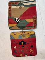 Fronts of both kilim cushion covers showing designs and tassels