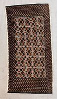 Full view of Turkmen mat showing overall pattern and fringe