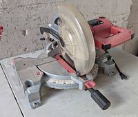 Front-left view of Skilsaw 3316 miter saw showing blade guard, base, angle scale