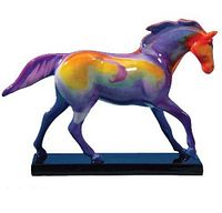 Left profile of multicolor ceramic horse on black base