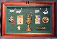 Shadow box with miniature golf memorabilia