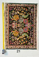 Full view of Persian pictorial Tabriz rug with measuring tape for scale