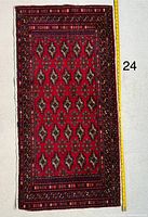 Full view of rug with measuring tape for scale