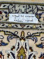 Signature cartouche and note indicating Kashan signed rug