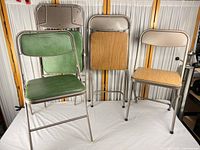 Group shot of all four Samsonite folding chairs, two open and two folded