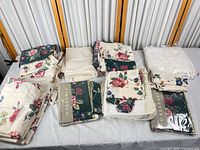 Overview of all folded bedding pieces and packaged dust ruffles